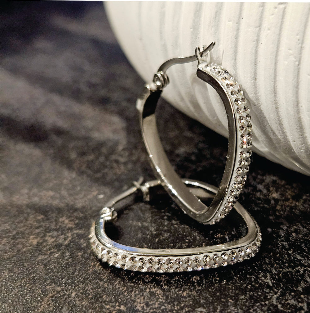 Style MELFI Silver: Abstract Heart Shaped Hoops embedded with Zirconia Gemstones