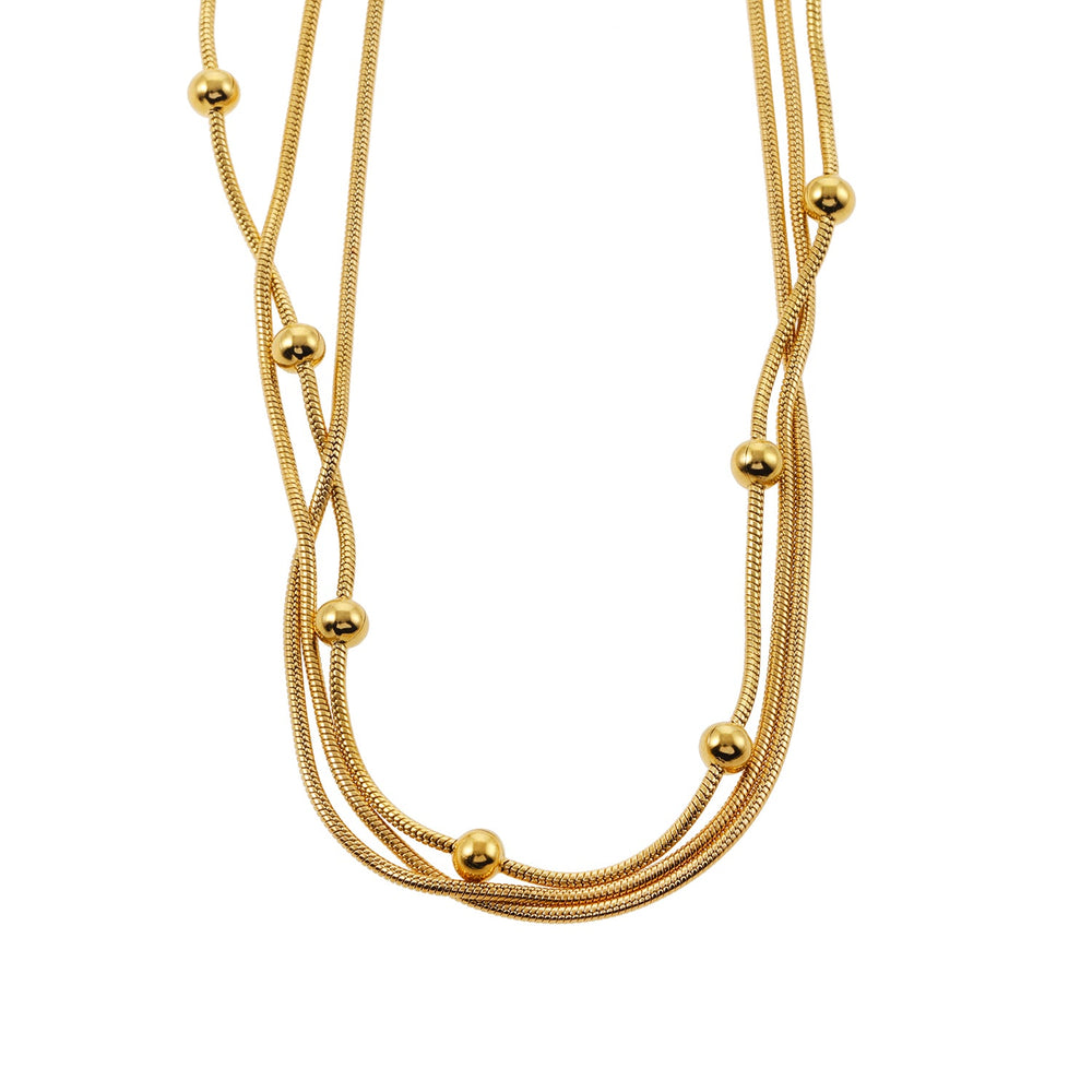 KAKIA : Collier superposé triple chaîne serpent avec accents de perles sphériques