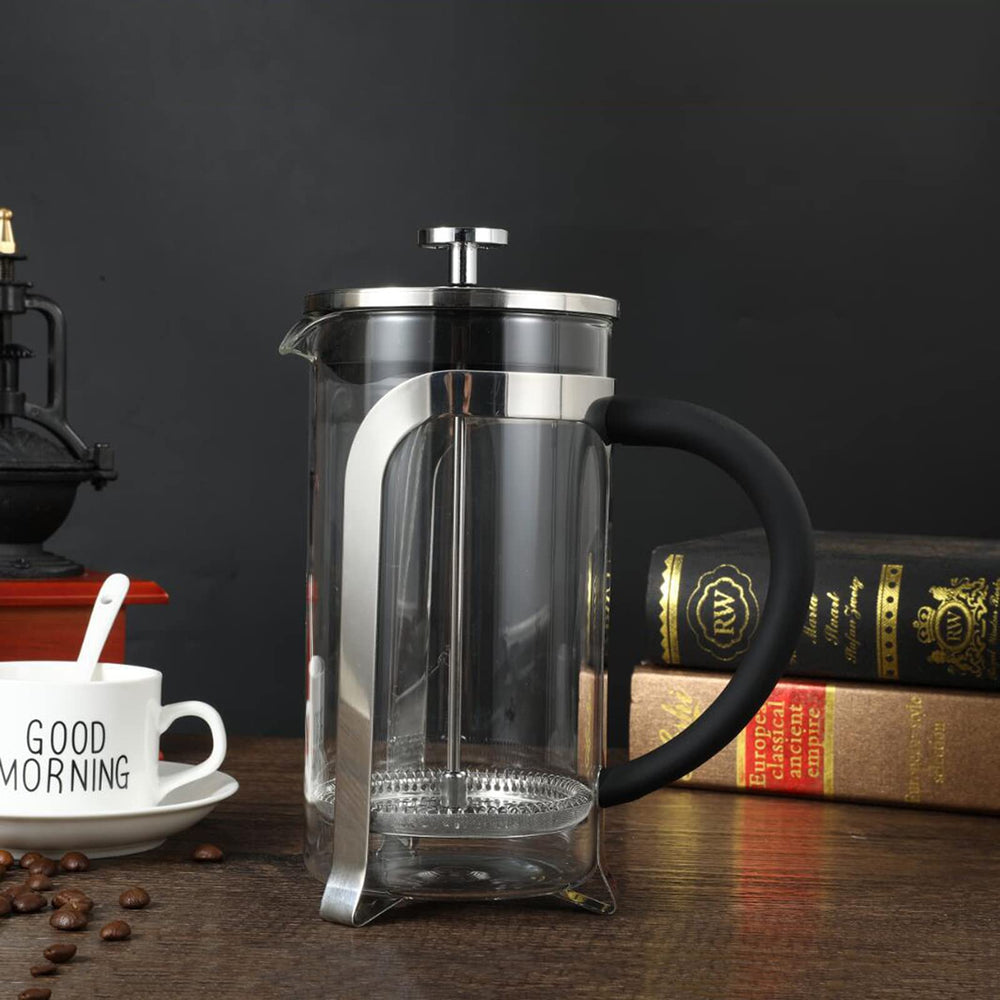 Cafetière à piston en verre avec cadre en acier inoxydable
