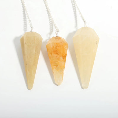Ensemble de 3 pendules en quartz doré à 6 facettes et perle