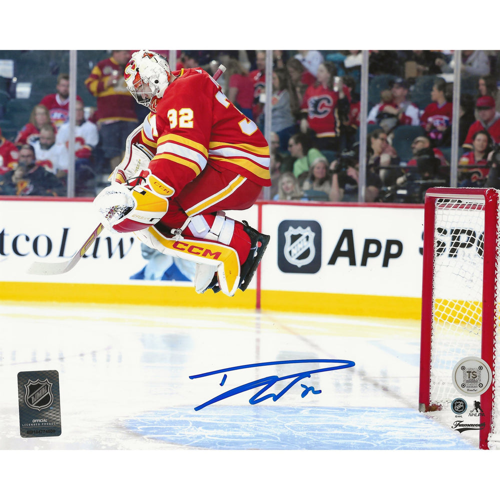 Dustin Wolf Autographed Calgary Flames Pre-Game Jump 8x10 Photo — TS Sports Memorabilia