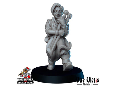 Miniature d'apprenti forgeron - Vae Victis | Marchand | Forgeron | Villageois | Citadin | Humain | Ville | Villageois | Wargaming | Pathfinder