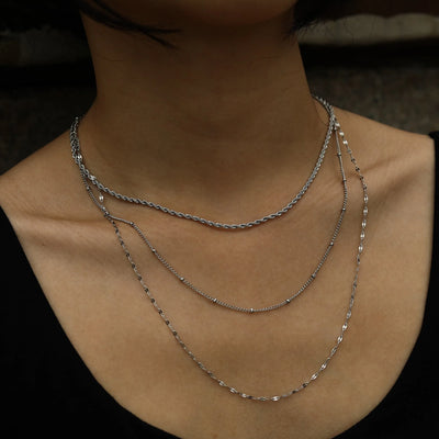 Collier ZURI à trois rangs et chaînes mixtes en argent
