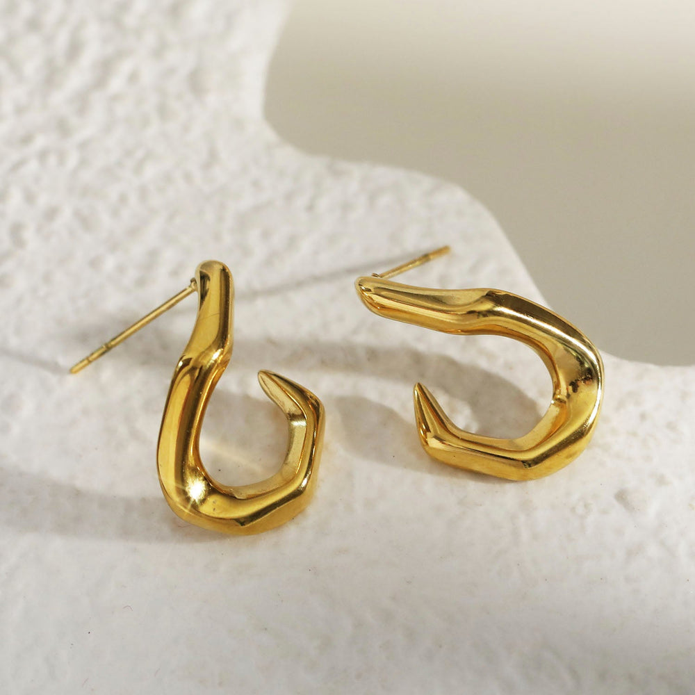 Boucles d'oreilles anneaux forme abstraite CAGLIO en or