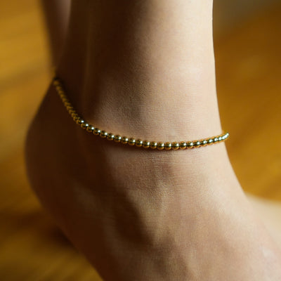 MANAMI LG : Cheville à billes contemporaine en or